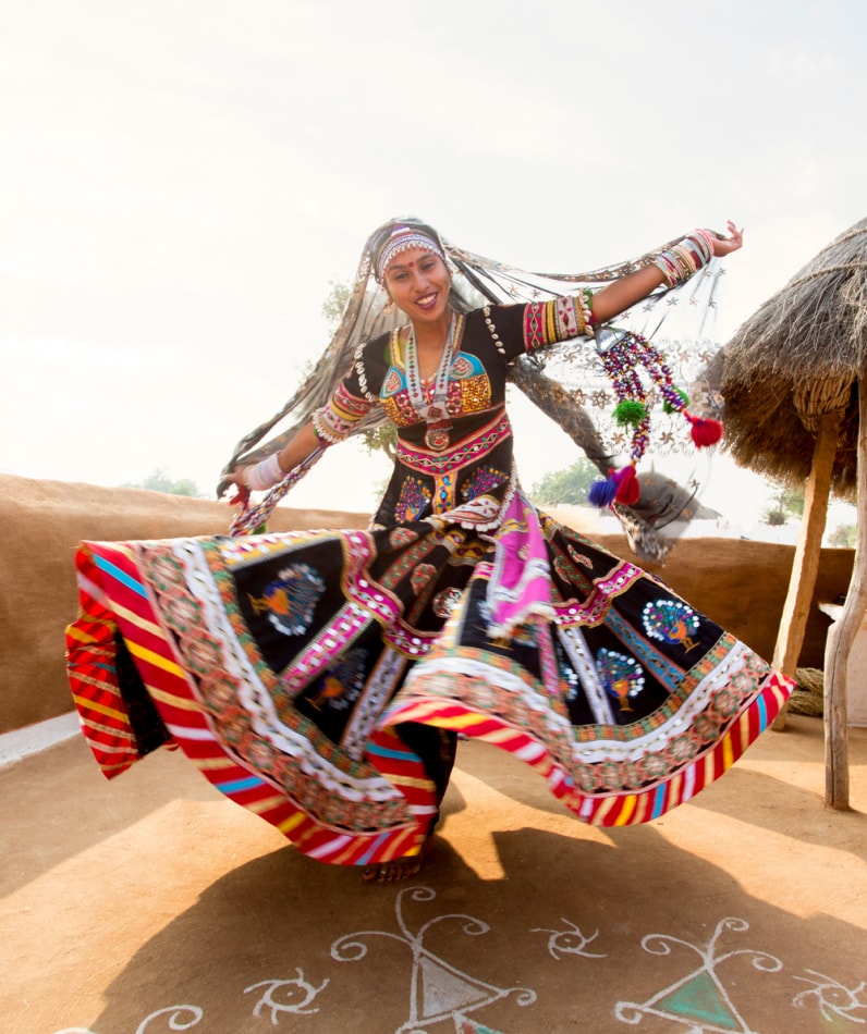 A girl smiling at a festival